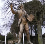 bronze statue of Thomas Paine in England